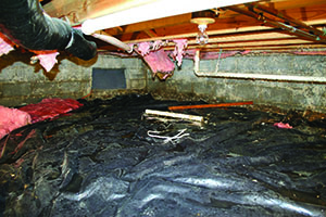 Improving performance & appearance. A vented crawl space (above) often has falling fiberglass insulation and moisture problems. 