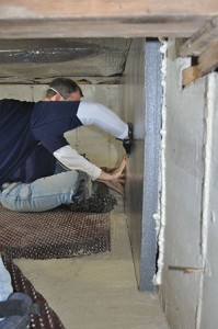 A smarter insulating strategy. Installed against crawl space walls, rigid foam insulation won’t degrade or fall out of place. 